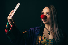 Renaissance Portrait Young Female Millennial Wearing Red Clown Nose, Taking Selfie With Camera Phone