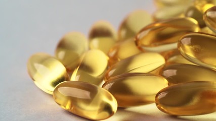 Wall Mural - Omega 3 vitamin yellow supplement gel capsules or Fish Oil, Cod liver oil medicines, macro shot close-up