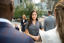 Portrait Confident Young Businesswoman On Urban Sidewalk