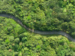Aerial view of asphalt road in tropical forest.Winding road from the high mountain pass.Top view forest texture landscape