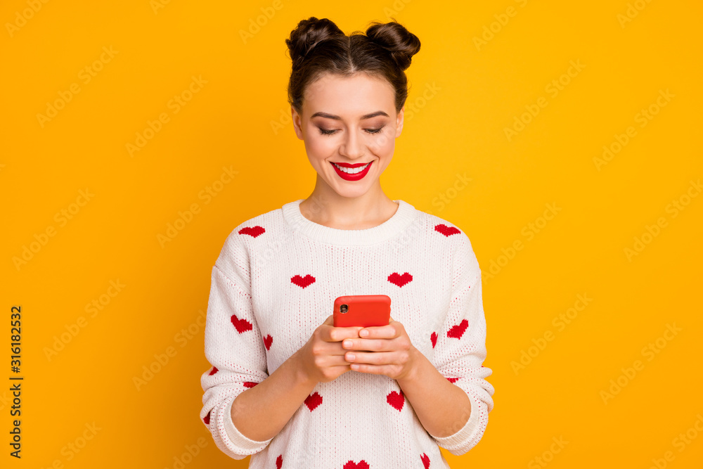 Portrait of her she nice-looking glamorous attractive lovely pretty charming cute cheerful girl using device chatting with boyfriend isolated over bright vivid shine vibrant yellow color background - obrazy, fototapety, plakaty 
