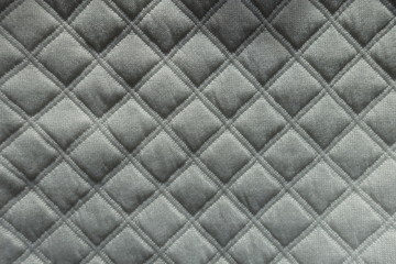  Quilted white fabric with diamonds pattern from above