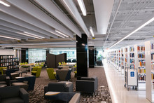 Modern Library Interior With Seating And Bookcases
