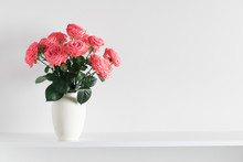 Beautiful Flowers, Pink Roses. Roses In Vase On Shelf Against White Wall. Valentines Day, Easter, Happy Women's Day, Mother's Day. Space For Text.