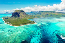 Aerial Panoramic View Of Mauritius Island - Detail Of Le Morne Brabant Mountain With Underwater Waterfall Perspective Optic Illusion - Wanderlust And Travel Concept With Nature Wonders On Vivid Filter