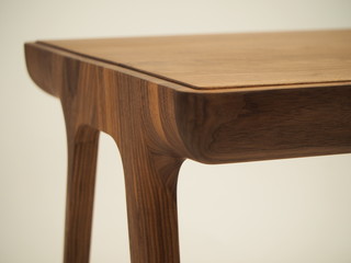 legs and edge of the table top of a beautiful table made of natural wood