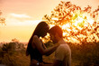 © metha275 - Silhouette of couple love had hug with beautiful sunset background. Travel with my love concept.