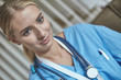 © lenetsnikolai - Woman doctor with stethoscope standing in the office