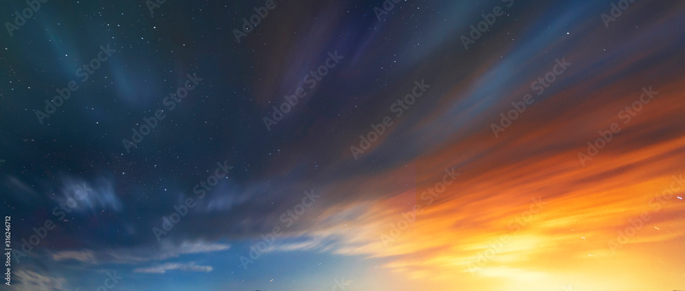 Long exposure clouds at the starry sky. Bright moon light behind the colorful clouds. Night photography. Astronomical background. - obrazy, fototapety, plakaty 