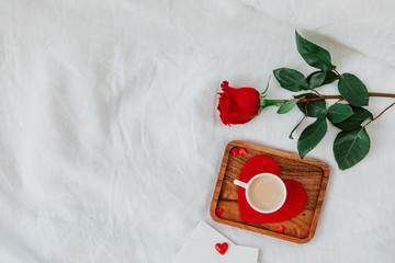 Wall Mural - Flat Lay ValentineÕs  concept,  coffee cup, rose and a gift. Top view, flat lay