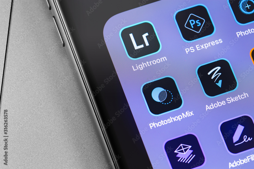 Adobe services apps on the screen smartphone closeup. Adobe Systems ...
