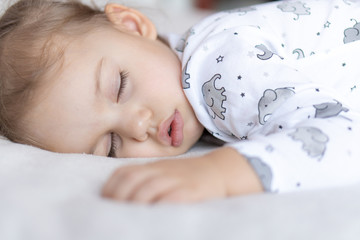 Above view of little girl in bed.