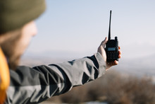 Man Holding Two-way Radio For Hiking In The Air