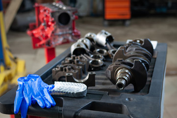 Wall Mural - car cylinder block and crankshaft in workshop. engine overhaul in a small service