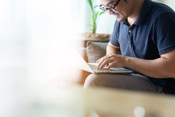 using computer.asian man hand typing message keyboard laptop shopping online.search information form