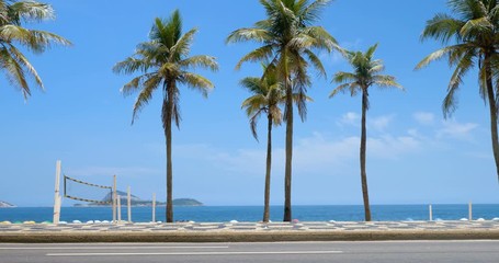 Wall Mural - Sunny day with Palms on Ipanema Beach in Rio De Janeiro, Brazil.