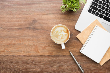 Wall Mural - cup of coffee on wooden table