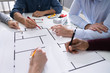 © Andrey Popov - Architects Drawing Electric Plan On Blueprint