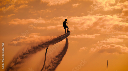 Cuadros en Lienzo Person propelling through air on flyboard