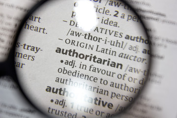 the word of phrase - authoritarian - in a dictionary.