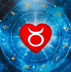 romantic red heart with zodiac symbol taurus over blue horoscope like astrology and love and relatio