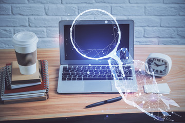 Desktop computer background in office and start up theme hologram drawing. Double exposure. Startup concept.