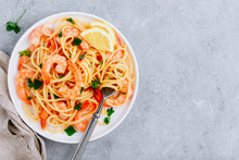 Seafood Pasta Spaghetti With Shrimps And Parsley On Gray Stone Background.