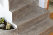 Microcement grey colour on staircase with matt finish, in combination with white walls and natural wooden floor