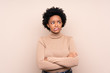 © luismolinero - African american woman over isolated background with confuse face expression