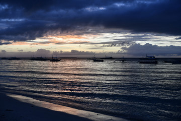 sunrise on a tropical island with a white sandy beach in the philippines