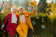 © Yakobchuk Olena - Happy elderly couple looking at bubbles outdoors