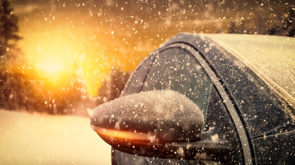 Poster - Winter car cover of frost and cold december sunse tt ime with snow flakes. 