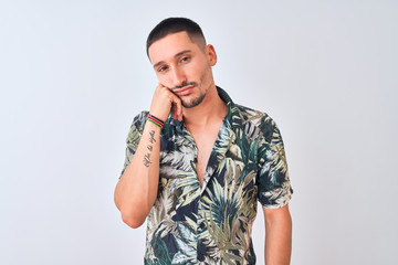 Wall Mural - Young handsome man wearing Hawaiian summer shirt over isolated background thinking looking tired and bored with depression problems with crossed arms.