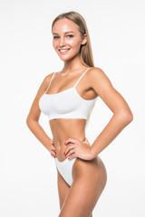 Poster - Young woman with beautiful slim perfect body in white bikini isolated white background