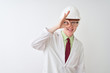 © Krakenimages.com - Albino scientist man wearing glasses and helmet standing over isolated white background doing ok gesture with hand smiling, eye looking through fingers with happy face.