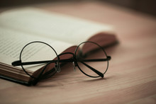 Round Glasses On A Book