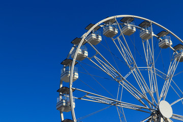 Wall Mural - Ferris Wheel Over Blue Sky