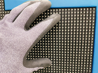 Technician adjusting led panel with led matrix