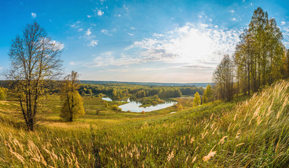 Wall Mural - beautiful panoramic view from above of the river valley and meadows in autumn on a sunny day.