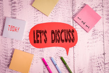 Text Sign Showing Let S Discuss. Business Photo Text Asking Someone To Talk About Something With Demonstrating Or Showing Ballpoints Pens Blank Colored Speech Bubble Sticky Notes Wooden Background