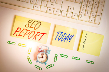 Fototapete - Handwriting text Seo Report. Conceptual photo notifying on how website is performing in search engine results Empty orange square papers and clock by the pc keyboard with copy space