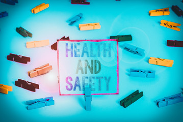 Poster - Word writing text Health And Safety. Business photo showcasing procedures intended to prevent accident in workplace Colored clothespin papers empty reminder white floor background office