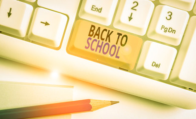 Poster - Word writing text Back To School. Business photo showcasing New Teachers Friends Books Uniforms Promotion Tuition Fee White pc keyboard with empty note paper above white background key copy space