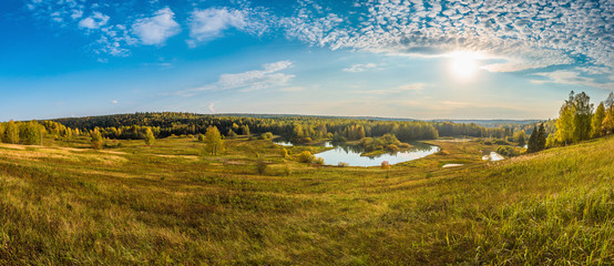Wall Mural - beautiful panoramic view from above of the river valley and meadows in autumn on a sunny day.
