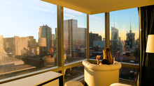 CLOSE UP: Bright Morning Sunbeams Shine Into Woman's Bedroom Overlooking City