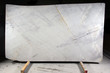 A white quartzite slab with red and dark stripes is called Bianco Appuano