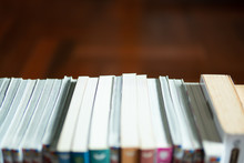 Pile Of Books With Wood Background