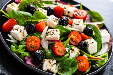 Wall Mural - Fresh greek salad - feta cheese, tomato, lettuce, black olives and onion