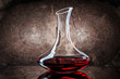 classic decanter with red wine on wooden background