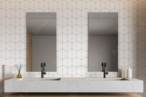 Fotografía White tile bathroom interior with double sink